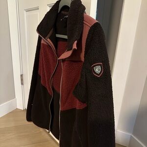 Kuhl Sherpa zip up jacket, worn once, black, burgundy, mauve. Size medium.
